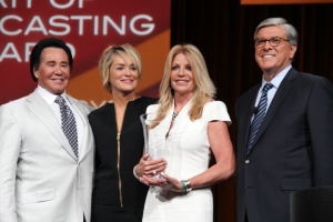 (L to R) Entertainer Wayne Newton, Actress Sharon Stone, Mrs. Marla Paxson receiving Spirit of Broadcasting Award posthumously for her husband 