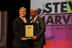 (L to R) NAB Pres. & CEO, Gordon Smith inducting Comedian, National Radio Personality Steve Harvey into the NAB Broadcasting Hall of Fame (during 2014 NAB Show) (Photo by Fredwill Hernandez/THT) 
